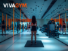 La expansión de VivaGym en Portugal exige blindar los derechos laborales Sala de entrenamiento de un gimnasio VivaGym con una usuaria realizando ejercicio entre máquinas de fitness y zonas de entrenamiento funcional.